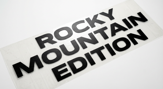 Detail view of custom tailgate text decal in Ontario highlighting durable vinyl application