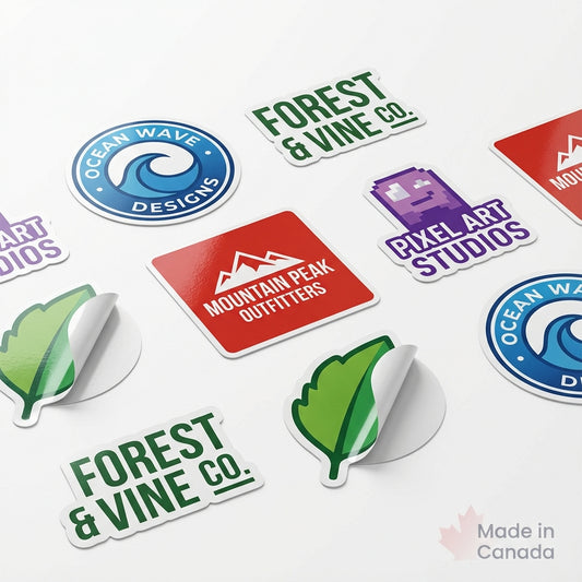 Custom die-cut vinyl decal samples with peeled edge detail