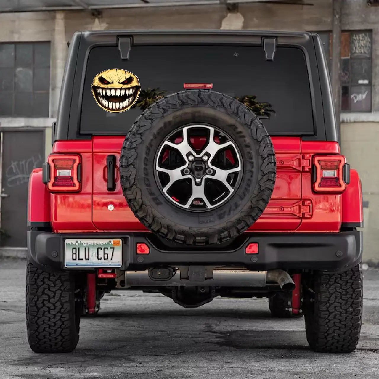 Here are a few options for alt text, keeping under 100 characters:

*   **Scary toothy face sticker on car window.**
*   **Me
