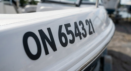 Close up of compliant boat official number lettering