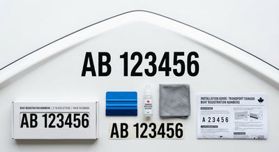 Black boat registration numbers on blue hull