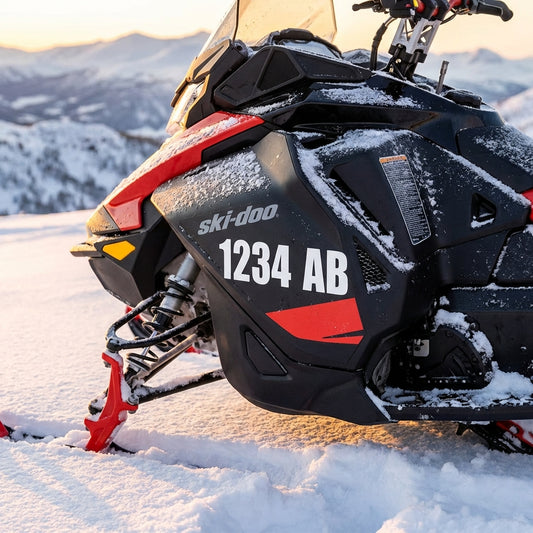 Close-up of snowmobile registration numbers applied to a snowmobile cowling